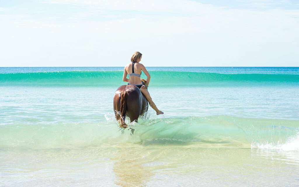 Heels Agency Editor Demi Karan Feature with Lauren Bath Travel Photographer Influencer Lauren on Horse on Beach